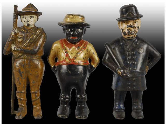 Appraisal: Lot of Cast Iron Figural Still Banks Description Inlcudes policeman