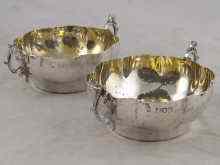 Appraisal: A pair of silver lobed bowls with cast handles hallmarked