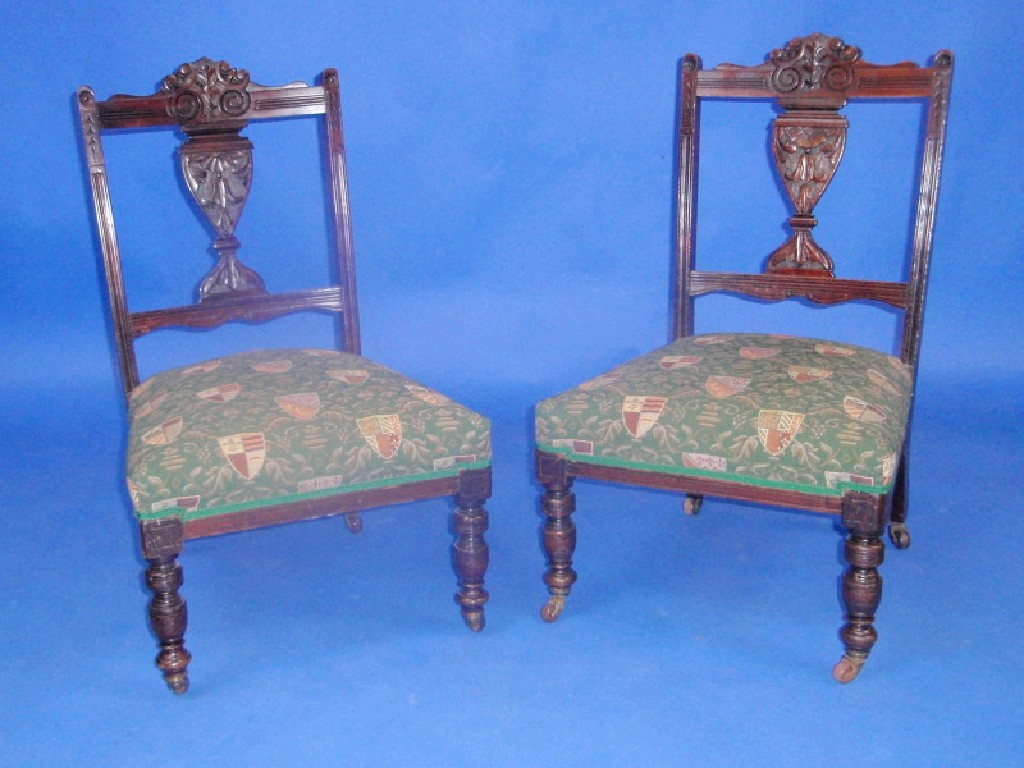 Appraisal: A pair of Victorian nursing chairs with tapestry upholstery