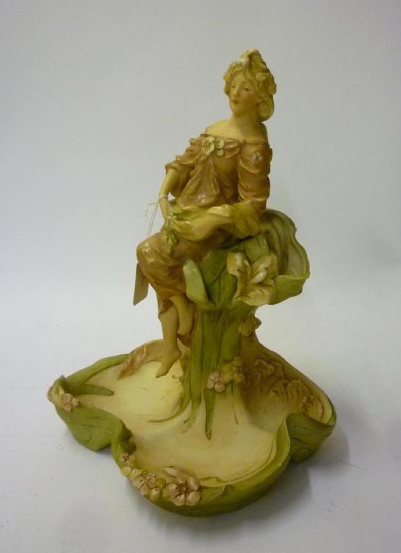 Appraisal: AN ART NOUVEAU ROYAL DUX PORCELAIN FIGURAL CENTREPIECE modelled as