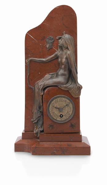 Appraisal: An Art Nouveau bronze and rouge marble figural clock early