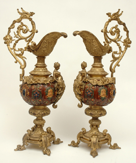 Appraisal: A PAIR OF TH CENTURY CONTINENTAL BRASS AND MAJOLICA EWERS