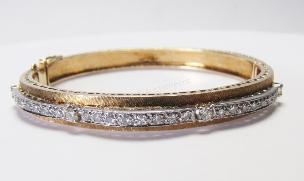 Appraisal: An antique K Florentine gold bangle bracelet with four brilliant