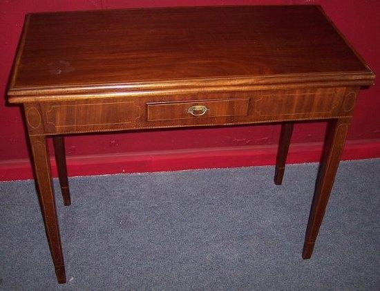 Appraisal: A George III mahogany tea table of rectangular form with