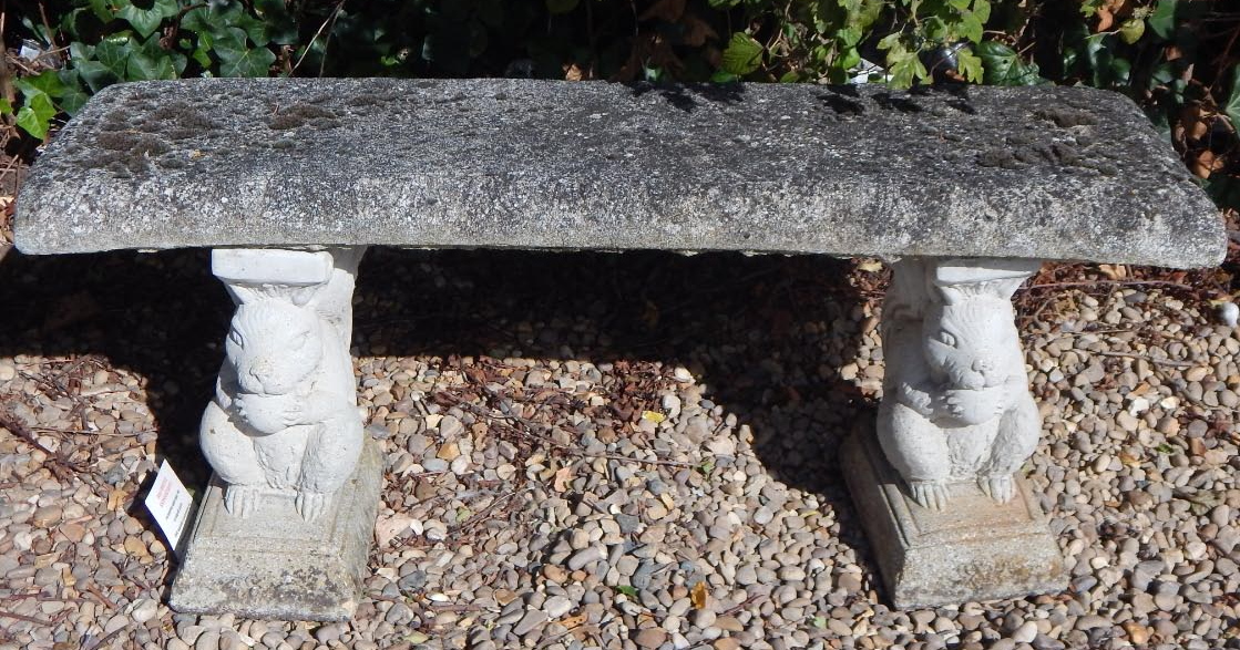 Appraisal: A modern composition garden bench on squirrel supports