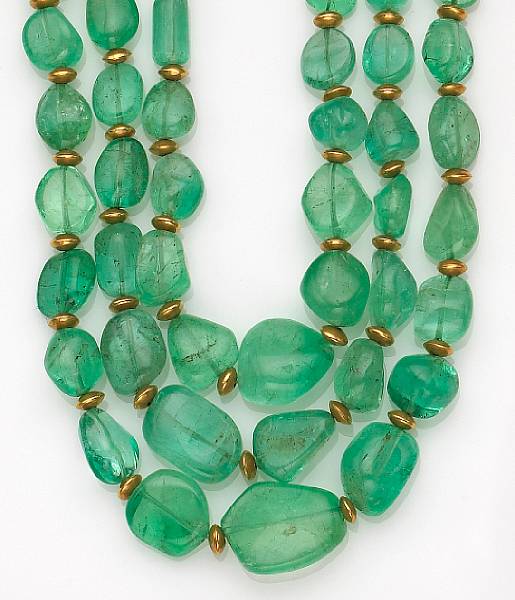 Appraisal: designed with three strands of graduated tumbled emerald beads accented