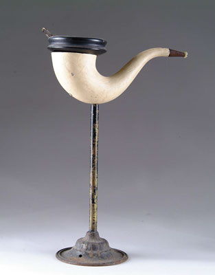 Appraisal: FIGURAL PIPE SMOKING STAND Cast metal hollow-bodied pipe on cast