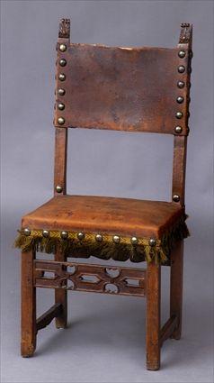 Appraisal: ITALIAN RENAISSANCE-STYLE CARVED WALNUT SIDE CHAIR With nailed leather back