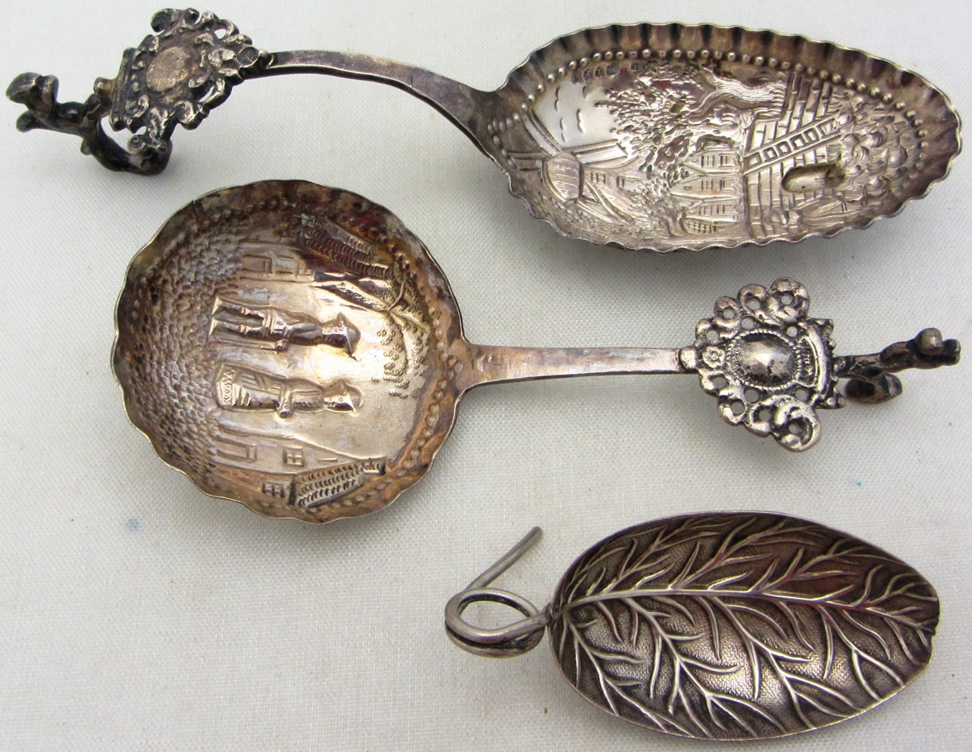 Appraisal: A silver tea caddy spoon formed as a leaf partly