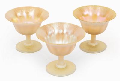 Appraisal: Three Tiffany favrile footed bowls with lustre finish initialled L