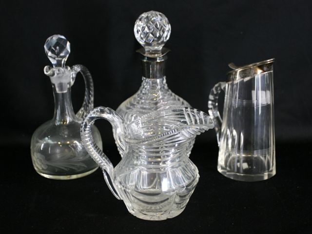 Appraisal: Two silver mounted sauce jugs together with two glass jugs