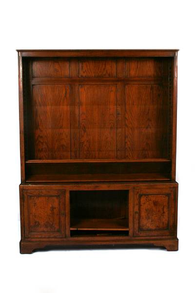 Appraisal: A French Provincial oak bookcase height ft in width ft