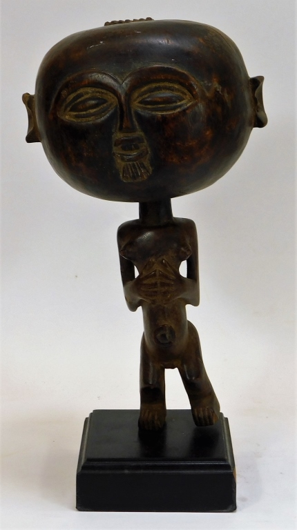 Appraisal: AFRICAN WOOD CARVED FERTILITY STATUE RATTLE Africa th CenturyFigure of