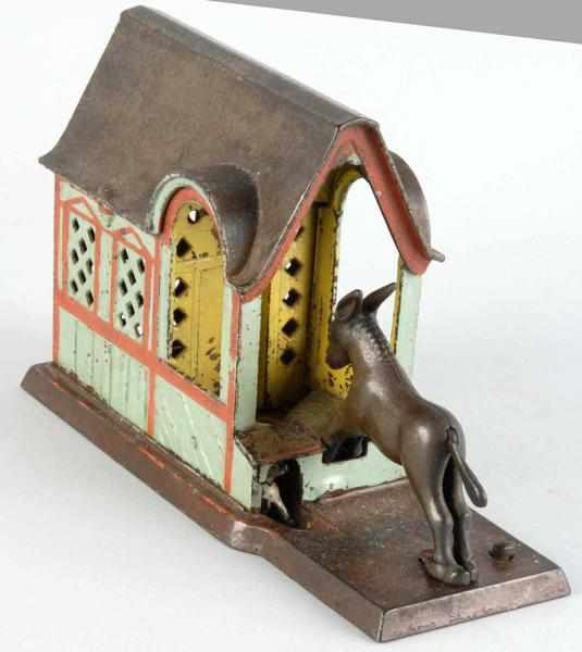 Appraisal: Cast Iron Mule Entering Barn Mechanical Bank Description Manufactured by