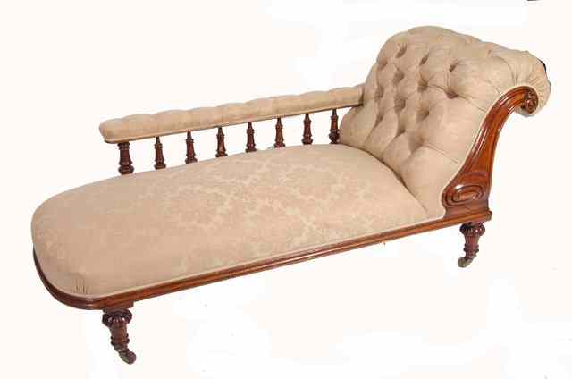 Appraisal: A VICTORIAN MAHOGANY FRAMED CHAISE LONGUE with spindle supported arm