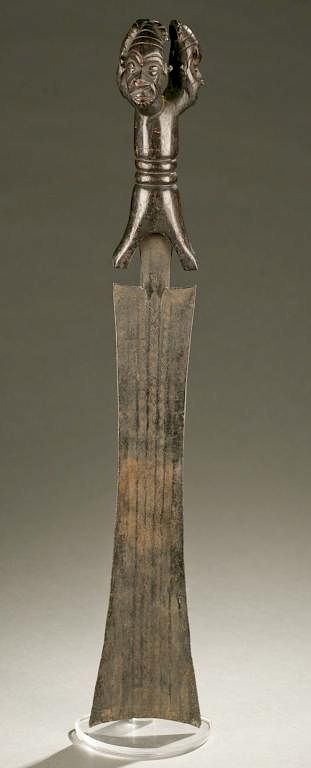 Appraisal: Tikar sword th century A sword with tri-headed wooden handle