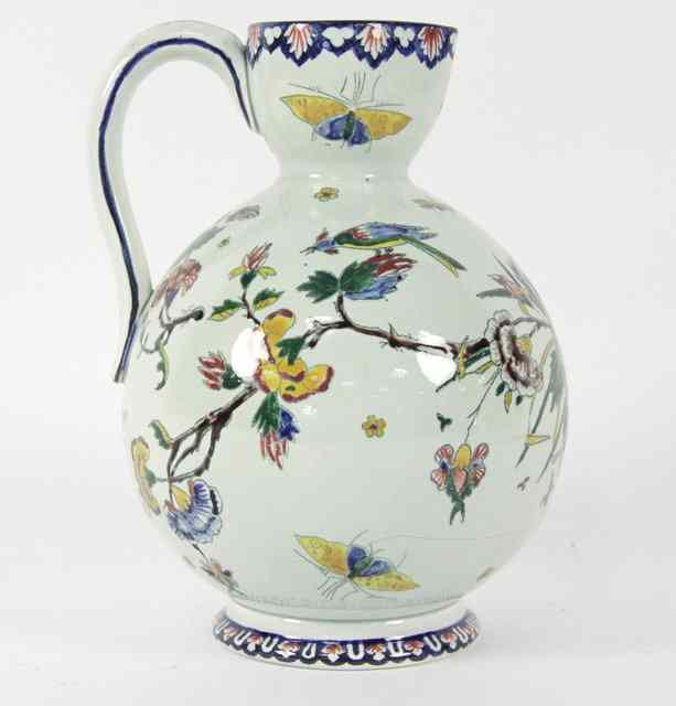 Appraisal: A th Century faience jug the globular body painted birds