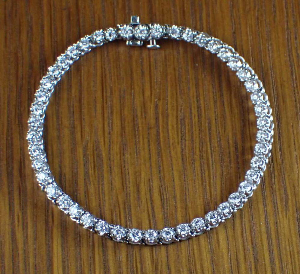 Appraisal: DIAMOND AND FOURTEEN KARAT WHITE GOLD BRACELET measuring - in