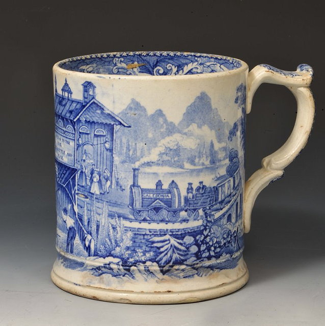 Appraisal: A BLUE PRINTED TANKARD 'Success to the Rail' and depicting