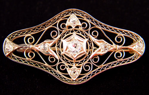 Appraisal: K GOLD FILIGREE AND DIAMOND BAR PIN BROOCH Centering a