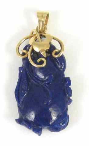 Appraisal: CARVED LAPIS LAZULI PENDANT set in k yellow gold The