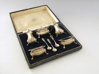 Appraisal: A five-piece silver condiment set oblong bellied form on four