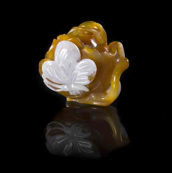 Appraisal: An Agate Carving of a Peony the caramel colored stone