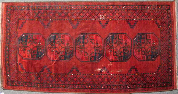 Appraisal: An Afghan rug size approximately ft in x ft in