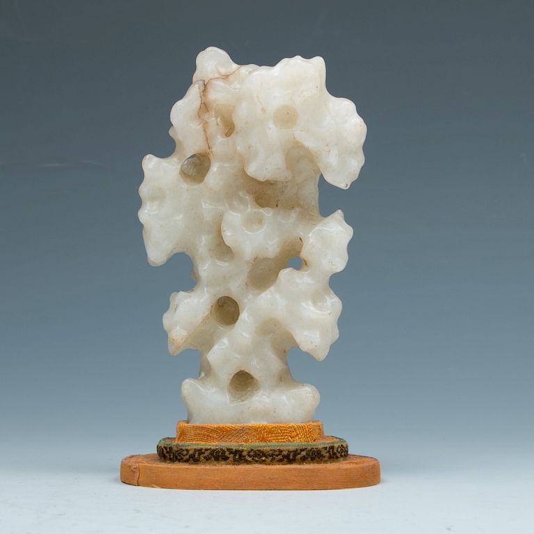 Appraisal: JADE SCHOLAR'S STONE QING Of vertical orientation expanding towards the