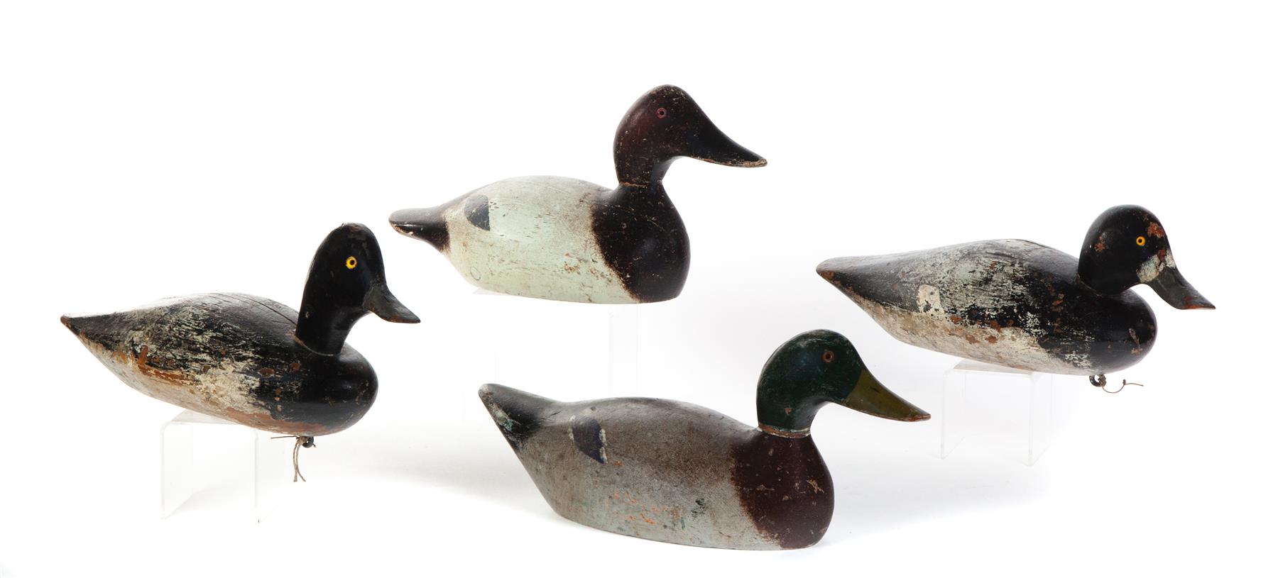 Appraisal: FOUR AMERICAN DUCK DECOYS Mid th century Old working paint