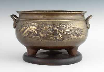 Appraisal: A Chinese Bronze Temple Censer The large tripod container has