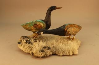 Appraisal: Pair of Stone Geese Mounted on Crystal Base Pair of