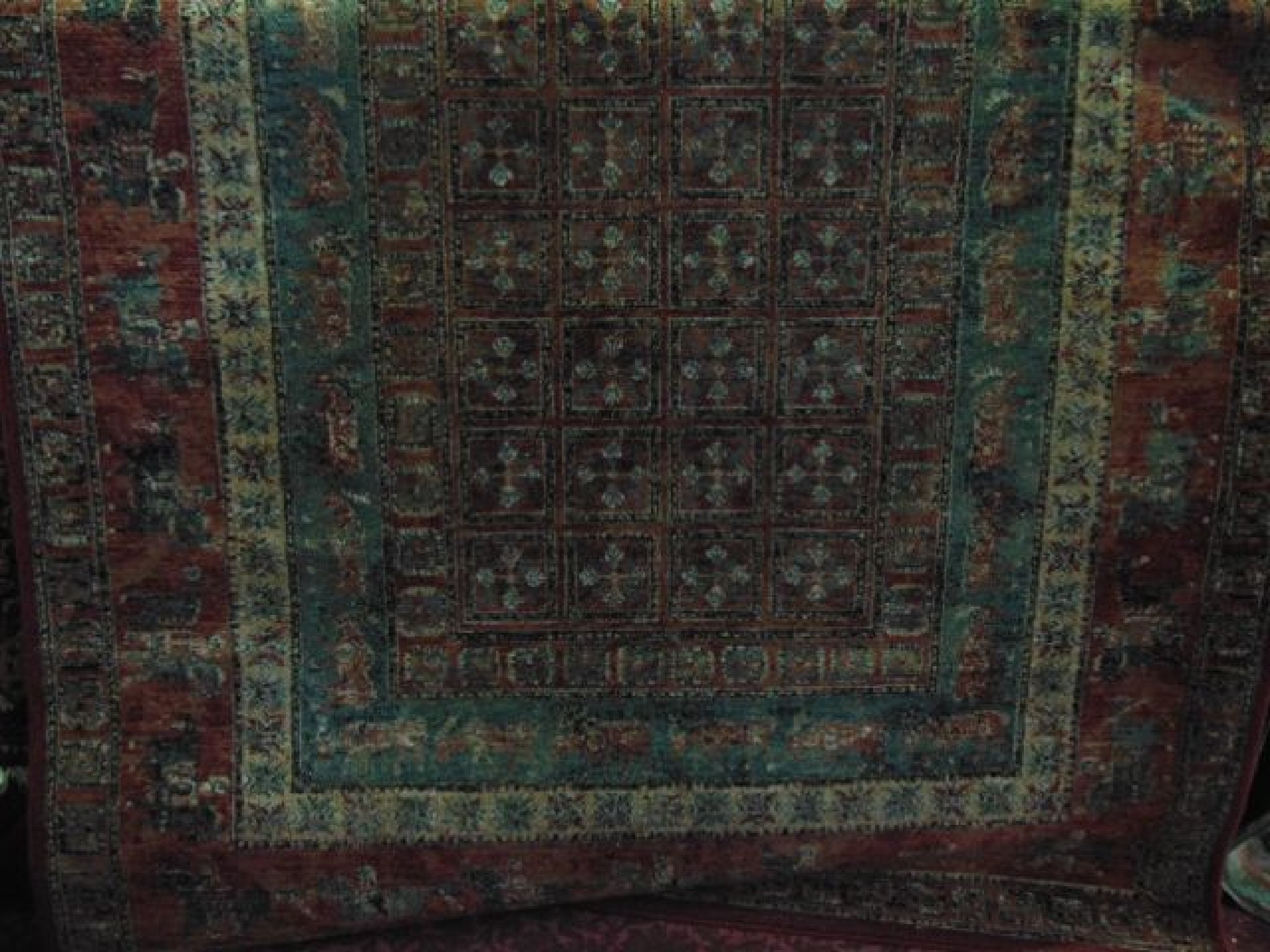 Appraisal: A Persian style wool rug with multi medallion centre upon