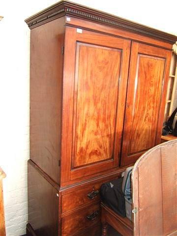 Appraisal: A Victorian mahogany linen press with two panelled doors above