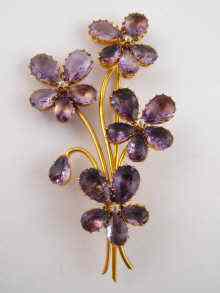 Appraisal: A yellow metal tests carat gold amethyst and diamond brooch