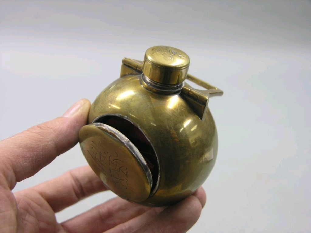 Appraisal: An unusual Victorian brass hip flask spherical shape with combination