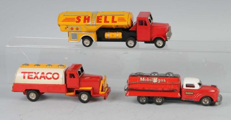 Appraisal: Lot of Tin Litho Gasoline Truck Friction Toys Description Japanese