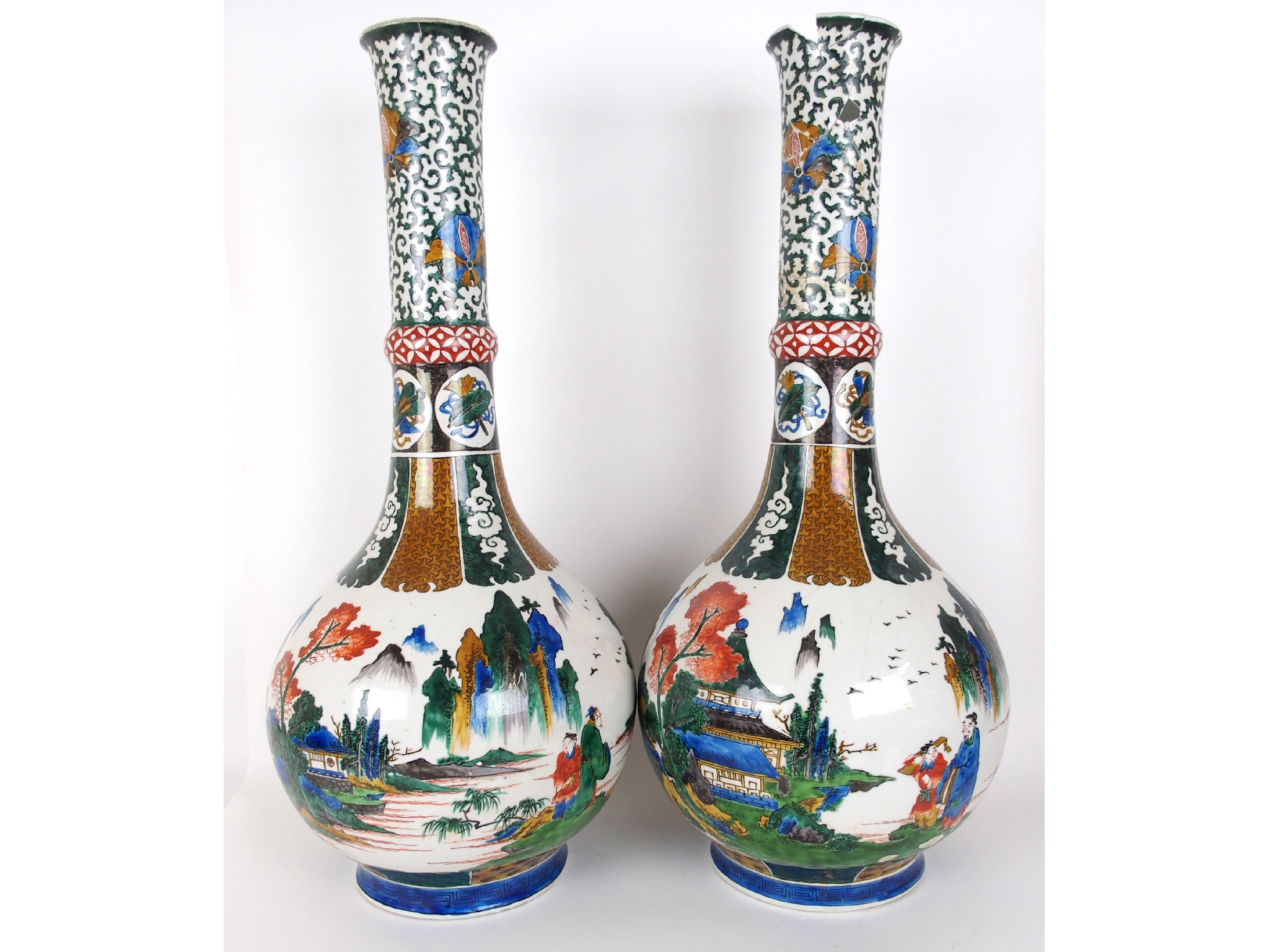 Appraisal: A pair of Japanese pottery baluster vasespainted with figures and