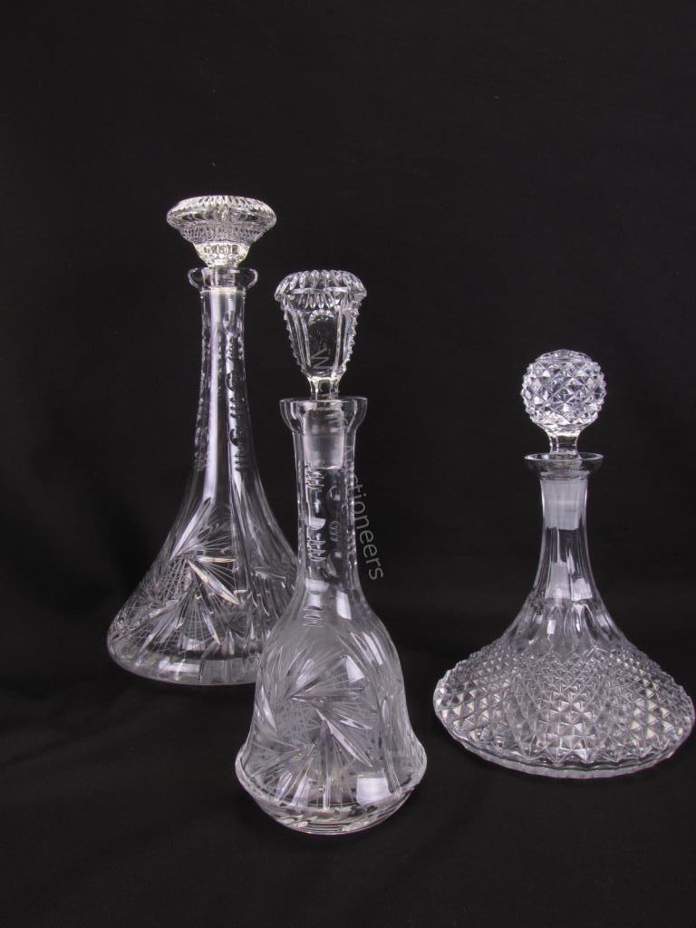 Appraisal: Three Glass Decanters ships decanter with tight diamond pattern spherical