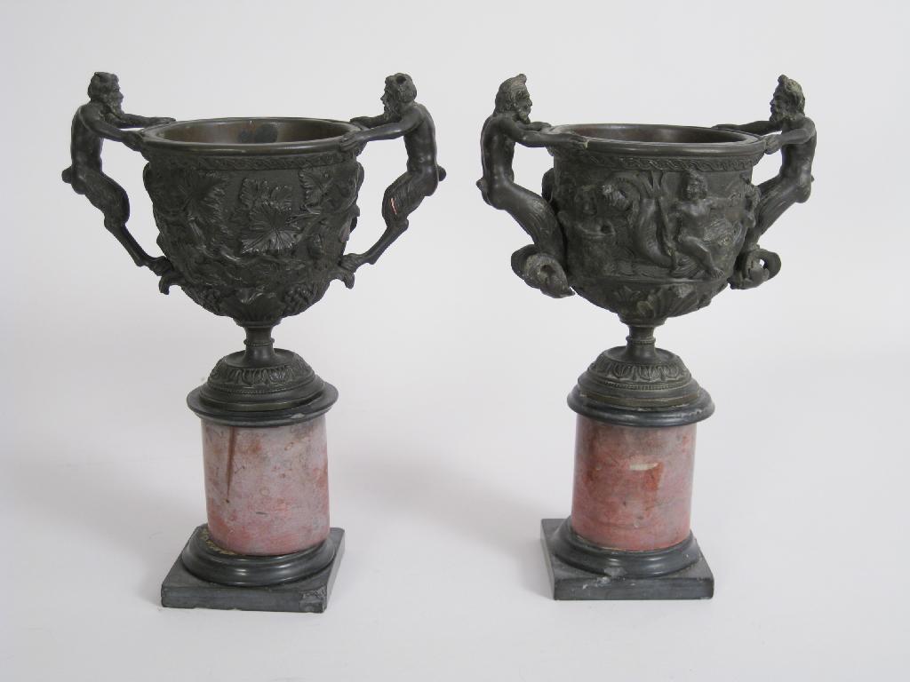 Appraisal: Pair of th Century bronzed Cups on Stands with handles