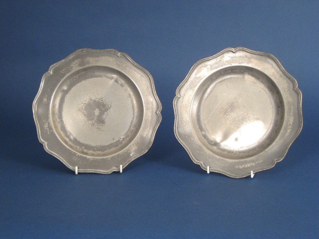 Appraisal: A set of six antique pewter Plates with shaped pie