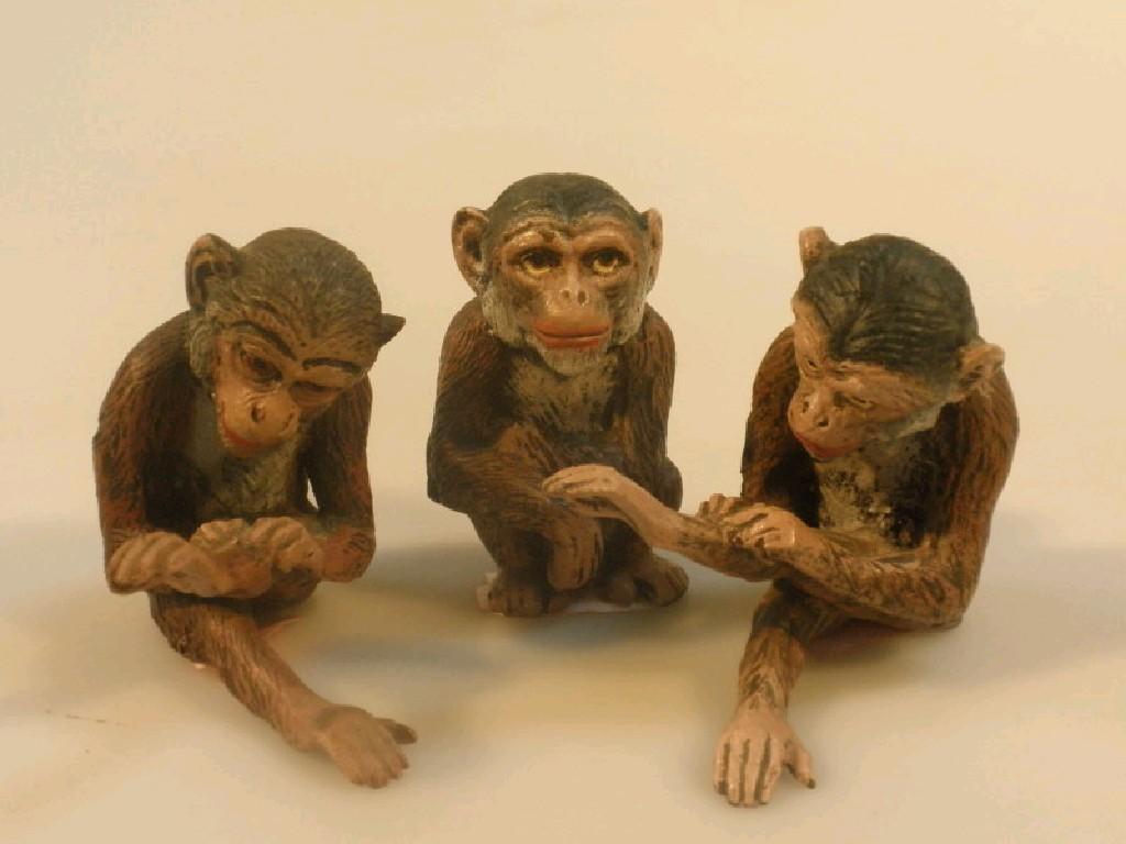 Appraisal: A group of three cold painted bronze monkeys one marked