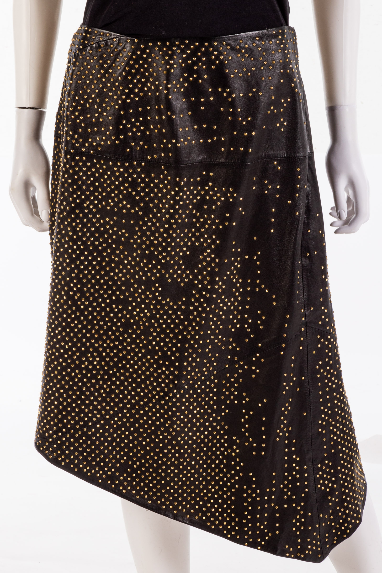 Appraisal: BLACK LEATHER GOLD STUDDED ASYMMETRICAL SKIRT By Donna Karan size