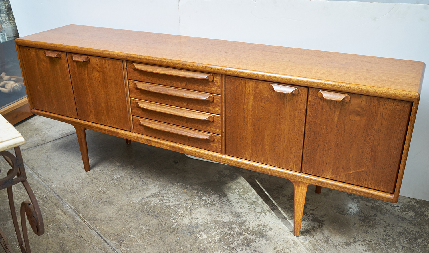 Appraisal: A s ENGLISH 'YOUNGER' SIDEBOARD Teak with central drawers and