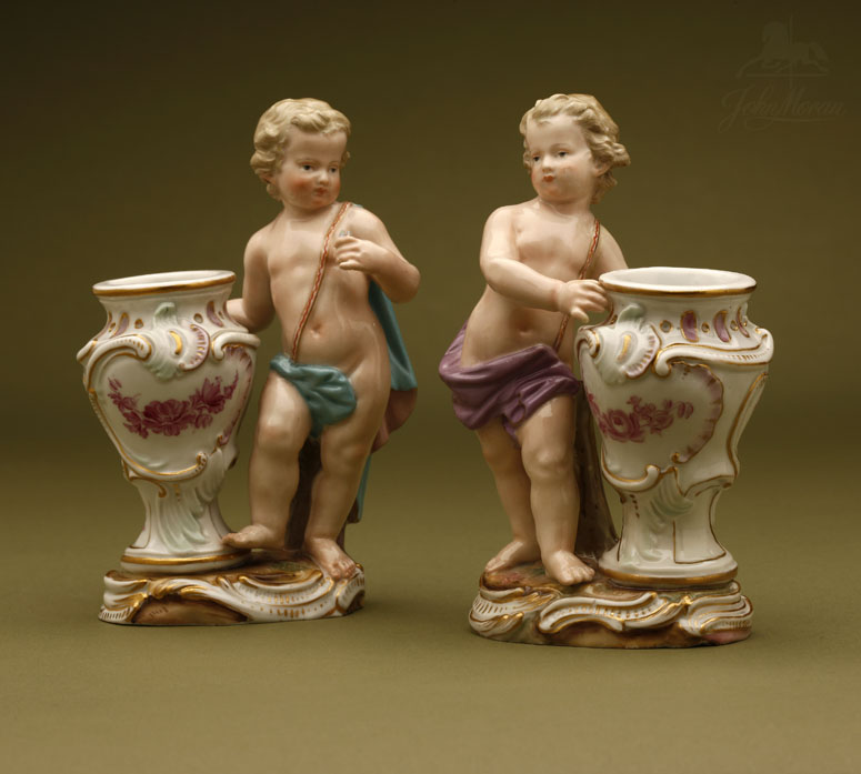 Appraisal: A pair of Meissen porcelain putto bud vases A pair