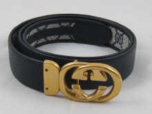 Appraisal: A Gucci leather belt with gold plated buckle