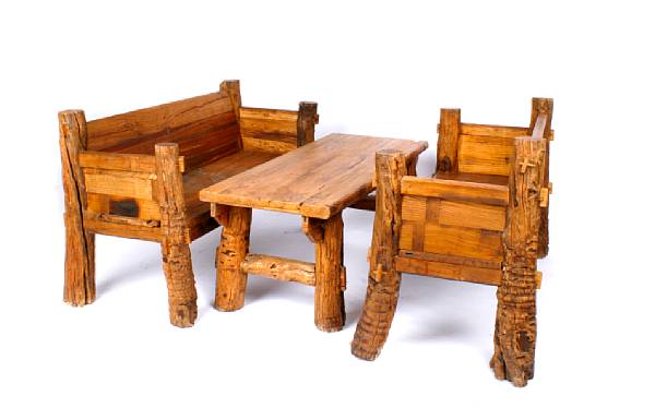 Appraisal: A three piece rustic garden set comprising two benches and