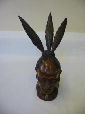 Appraisal: A STAINED WOOD INKWELL carved as a red Indian head