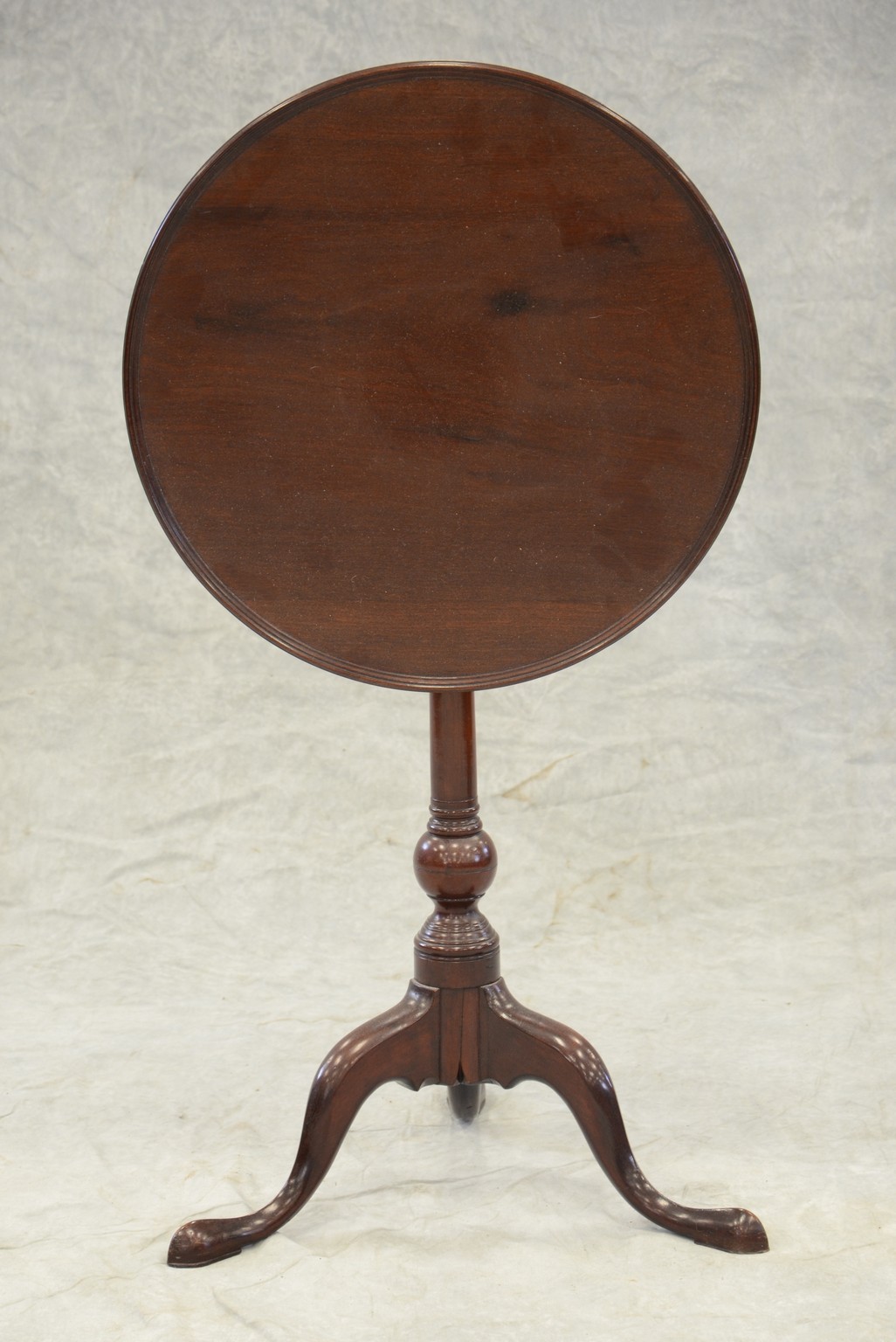 Appraisal: Mahogany dish top tilting candlestand with suppressed ball turning American