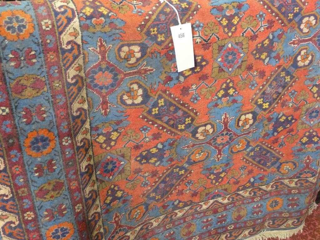 Appraisal: A Middle Eastern design carpet with two elongated spandrels on